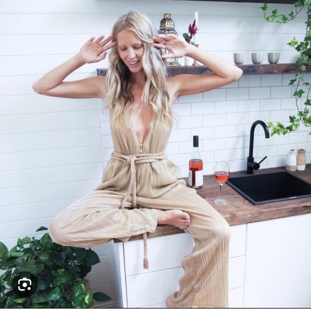 Beautiful Spell and the Gypsy jumpsuit. Size Med, would fit best Med-Large.